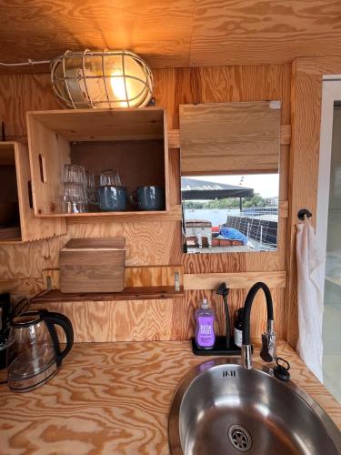 a kitchen counter with a sink in a caravan at Berlin River Retreat in Berlin