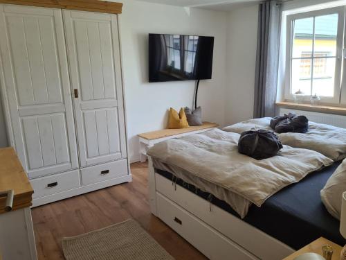 a bedroom with a bed with two bags on it at Apartment Waldstein Terrassen by Interhome in Weißenstadt