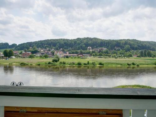 a view of a lake with a town in the background at Apartment Bastei by Interhome in Kurort Rathen