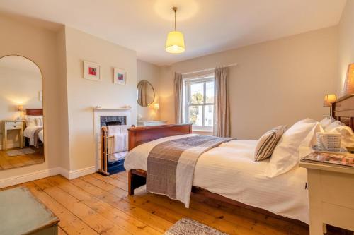 a bedroom with a bed and a fireplace at 2 Bed in Aldeburgh oc-fsh in Aldeburgh