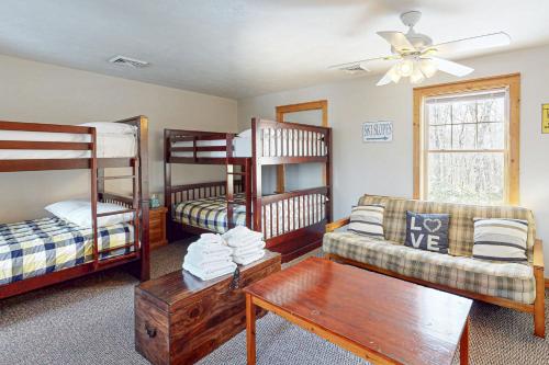 a living room with bunk beds and a couch at Northridge 199 in Tannersville