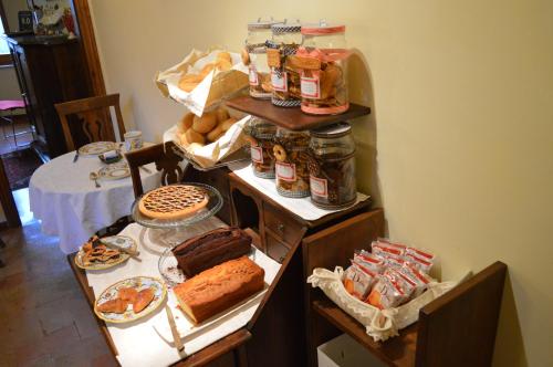 a table with many different types of food on it at Hotel Pallotta in Assisi