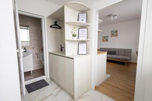 a room with a kitchen and a living room at Hotel Cheese in Shumen