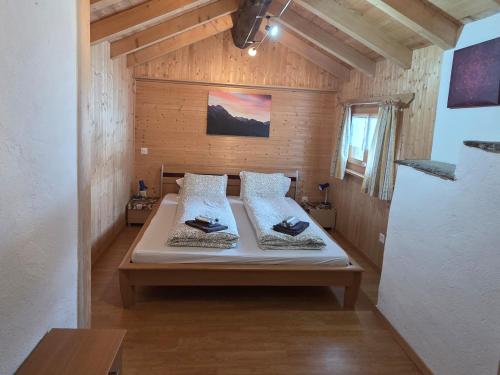 a bedroom with a large bed in a room at Chalet San Bernardino in San Bernardino