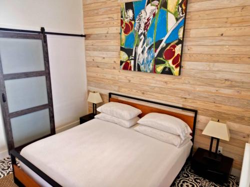 a bedroom with a bed with two pillows at Lodge 2 on the Mason TX square in Mason