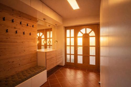 a bathroom with a bench and a mirror at Villa mit Pool und Garten in Thalheim bei Wels