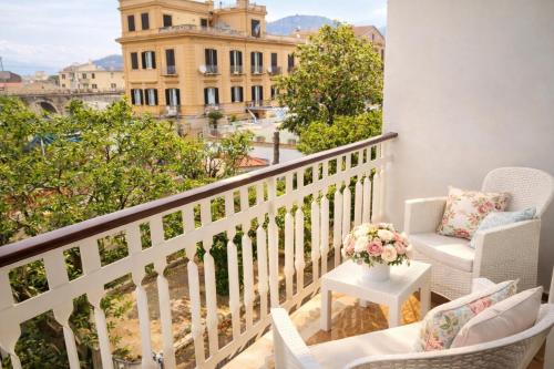 a balcony with chairs and a table with a view at Sorrento life 3 in Sant'Agnello