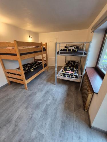 a room with two racks of wine bottles at Chillout Place in Wieprz