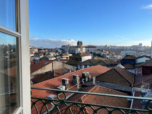a view of a city from a window at Clérigos Cinema Guesthouse in Porto