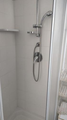 a shower with a glass door in a bathroom at Borgo marino litorale salus in Sciacca