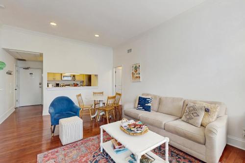 a living room with a couch and a table at The Goose Getaway in Savannah
