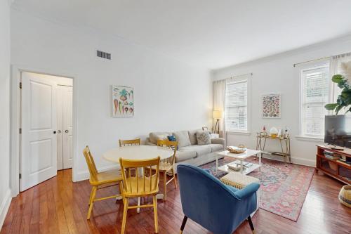 a living room with a table and a couch at The Goose Getaway in Savannah