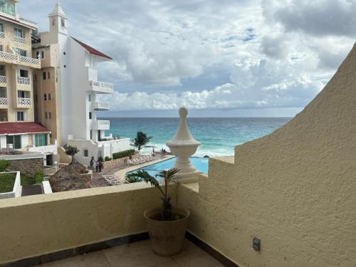 a view of the ocean from the balcony of a hotel at Cancun Plaza Condo Mexico in Cancún