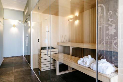 a bathroom with a shower and a glass wall at Riviera Hotel in Senigallia