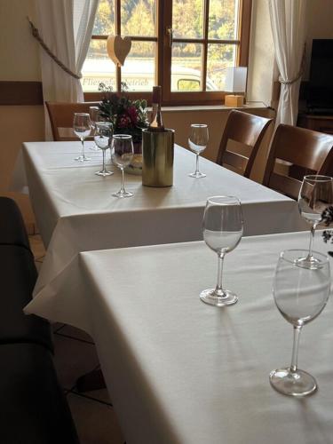 a group of wine glasses sitting on a table at Ferienhaus Knecht in Neef