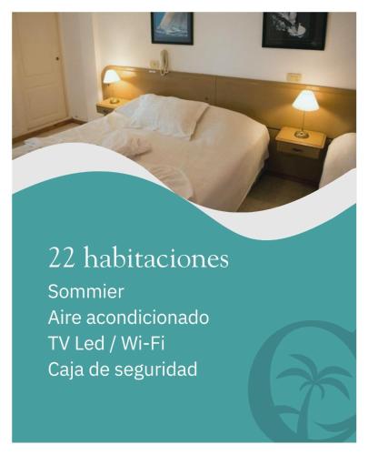 a bedroom with a bed with a white sheets at Clima Termal Suites in Federación