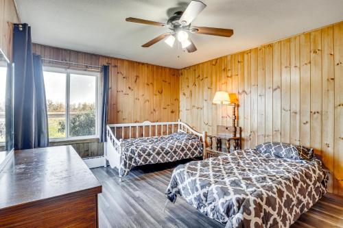 a bedroom with two beds and a ceiling fan at Secluded Albany Escape, Pet Friendly w/ Fee in Albany