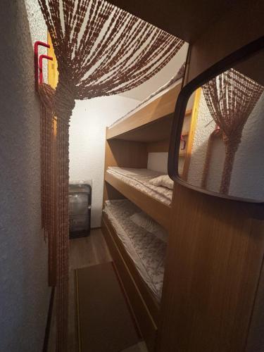 a mirror reflection of a bedroom with bunk beds at Casa Vacanze S&B in Viola