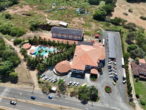 an overhead view of a resort with a pool and parking lot at Paradise Resort in Los Santos