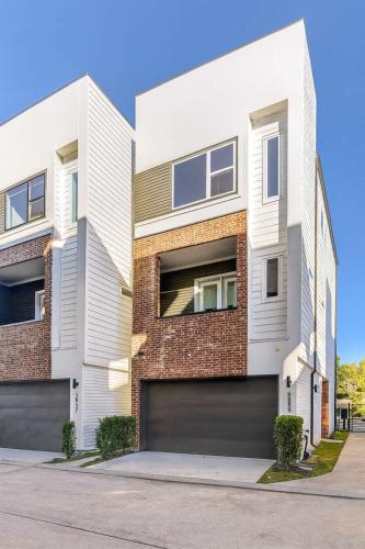 an apartment building with a garage at Elite Galleria Luxe World Cup in Houston