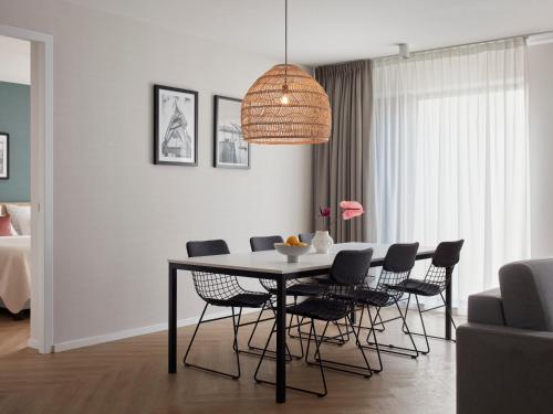 a dining room with a table and chairs at Numa Amsterdam Docklands in Amsterdam