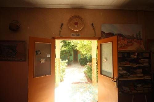 a door leading to a hallway with a walkway at Kasbah Hotel Camping Jurassique in Ifri