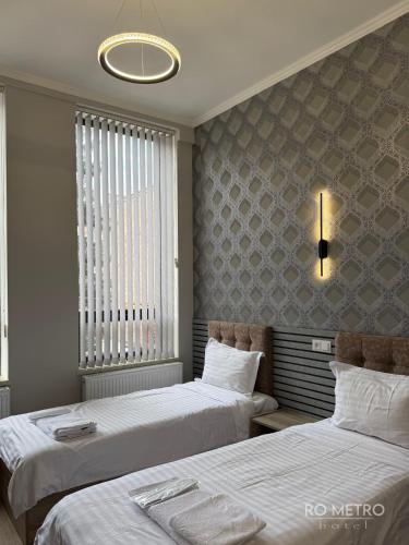 En eller flere senge i et værelse på RO METRO