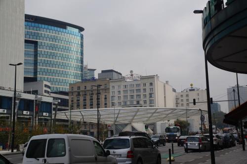 a busy city street filled with traffic with buildings at Royal Hotel in Brussels