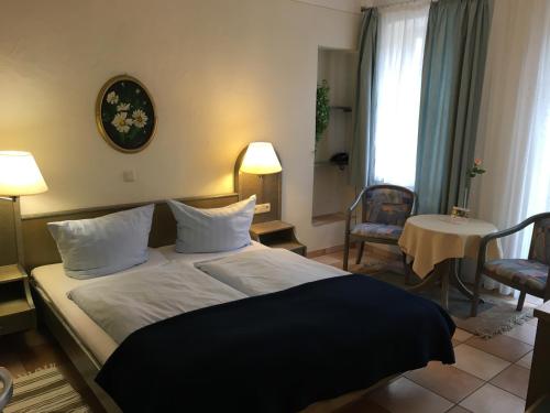 Postel nebo postele na pokoji v ubytování Hotel Springiersbacher-Hof