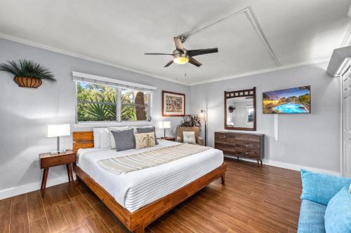a bedroom with a bed and a ceiling fan at Siesta SunDaze - 5430 in Sarasota