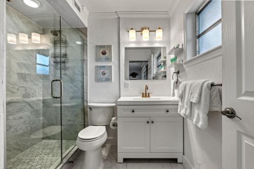 a bathroom with a shower and a toilet and a sink at Siesta SunDaze - 5430 in Sarasota
