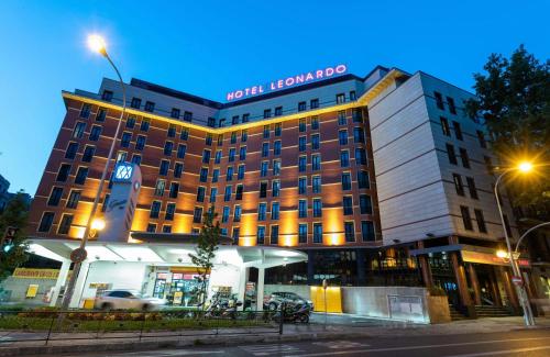 a hotel with a sign on the front of it at Leonardo Hotel Madrid City Center in Madrid