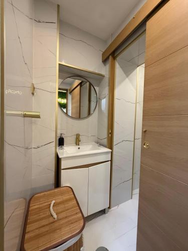 a bathroom with a sink and a mirror at Feeling Porto House in Porto