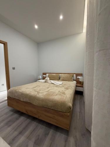 a bedroom with a bed in a white room at Feeling Porto House in Porto