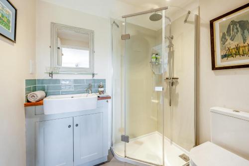 a bathroom with a sink and a shower at 1 Bed in Snape oc-sfgcs in Snape