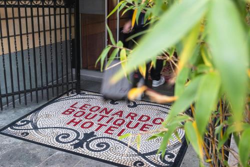 a welcome mat in front of a door at Leonardo Boutique Hotel Maastricht City Center in Maastricht