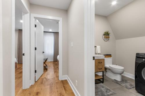 a bathroom with a toilet and a sink at The Dream House Retreat in Necedah