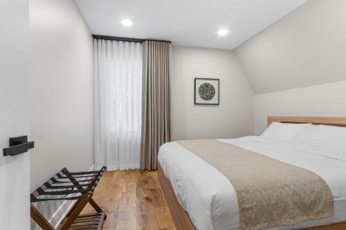 a bedroom with a large bed and a window at The Dream House Retreat in Necedah