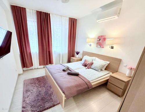 a bedroom with a bed with two shoes on it at Basilica Apartments in Budapest