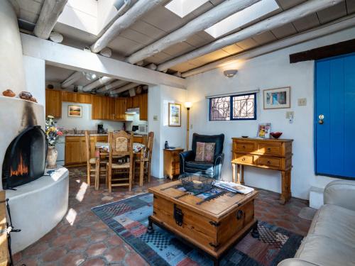 a living room with a couch and a table at Casita Don Manuel in Santa Fe