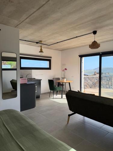 a bedroom with a bed and a table with a view at Casa Bela in Villaverde