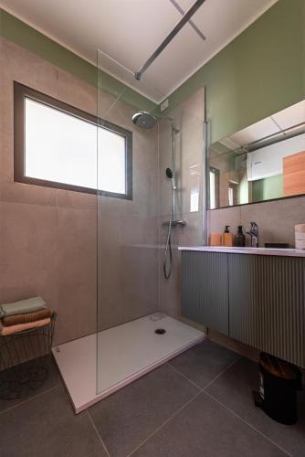 a bathroom with a shower with a glass door at B&B Sentiero Rusca in Sondrio