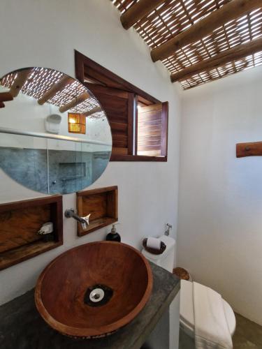 a bathroom with a wooden sink in a room at Vila Cacau pousada - Serra Grande in Serra Grande