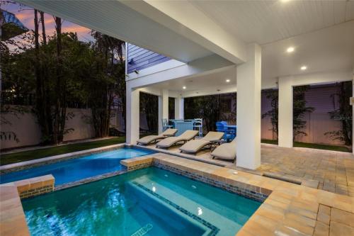 a swimming pool in a house at LUXURY VACATION HOME! ADD A GOLF CART!! in Bradenton Beach