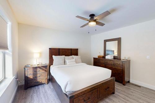 a bedroom with a bed and a ceiling fan at Schroon Lake Retreat in Schroon Lake