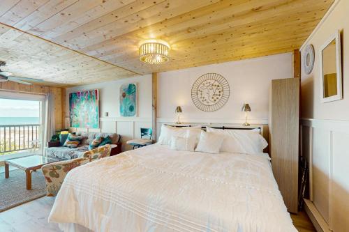 a bedroom with a large bed and a couch at Sun Mark 253 in Ocean City