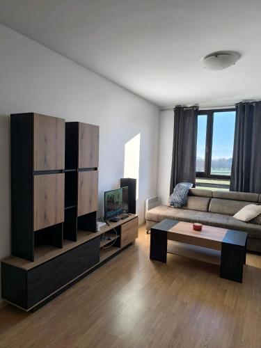 a living room with a couch and a coffee table at Sasha Yo in Razlog