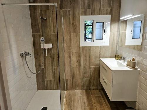 a bathroom with a shower and a sink at Poolside Apartment Barcelona Sant Cugat in Sant Cugat del Vallès