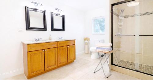 a bathroom with a sink and a shower at Family-Friendly Beach Home in West Palm Beach, FL in West Palm Beach