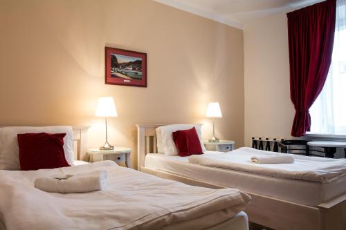 Postel nebo postele na pokoji v ubytování Pivovar Hotel Na Rychtě